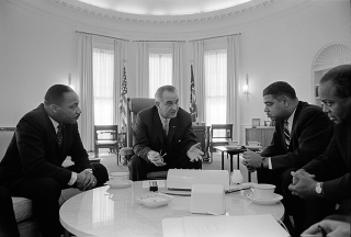 President Lyndon B. Johnson talks with civil rights leaders at the White House on Jan. 18, 1964. From left, Dr. Martin Luther King Jr., head of the Southern Christian Leadership Conference; Johnson; Whitney Young, executive director of the National Urban League; and James Farmer, national director of the Congress of Racial Equality. Not shown: Roy Wilkins, executive secretary of the NAACP.